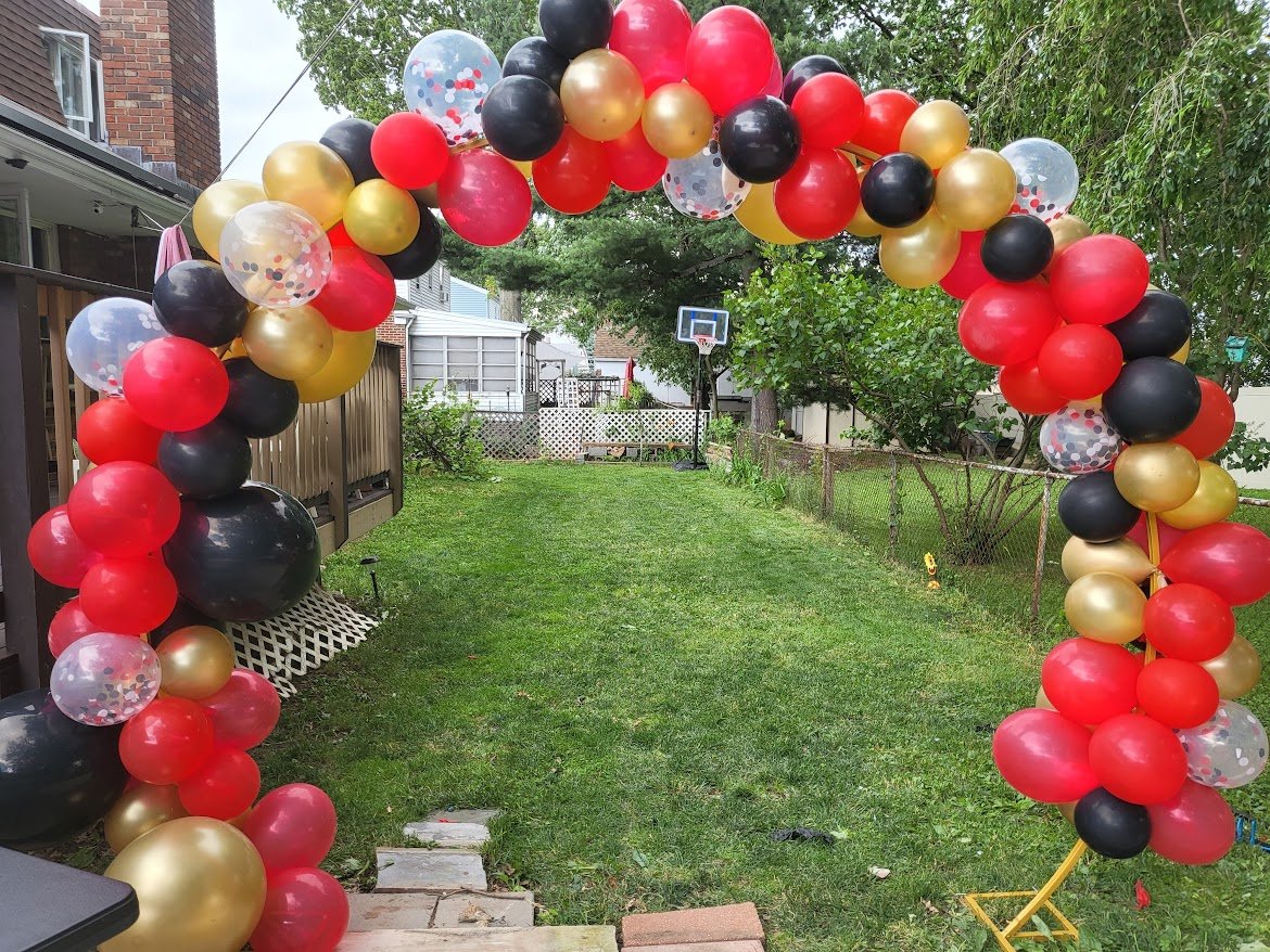 red and gold balloon arch